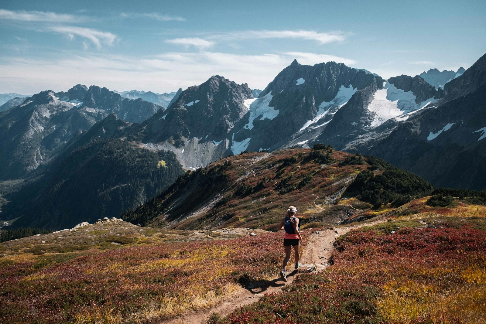 A runner travels across Sahale Arm, North Cascades, WA.